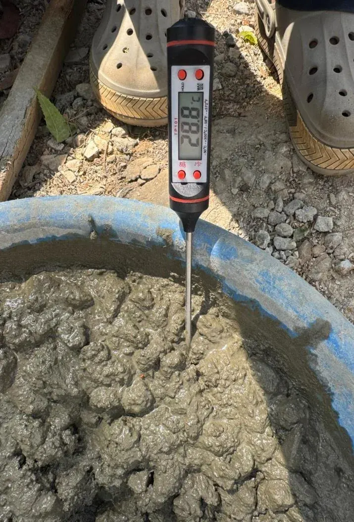 Thermometer probe in fresh concrete